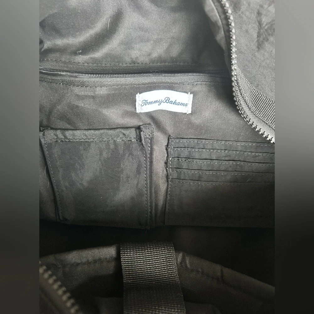 Tommy Bahama black travel duffle bag with hand and shoulder straps